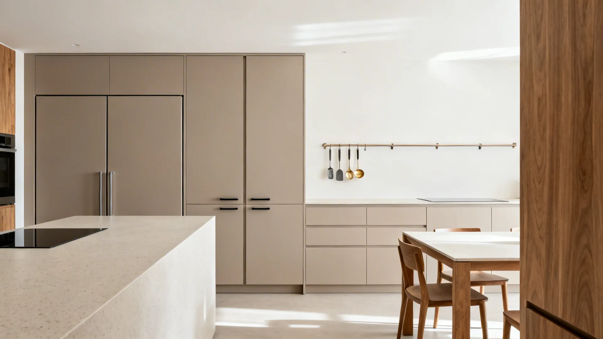 Minimalist kitchen-dining with paneled appliances, pocket pantry doors, and handleless matte fronts.