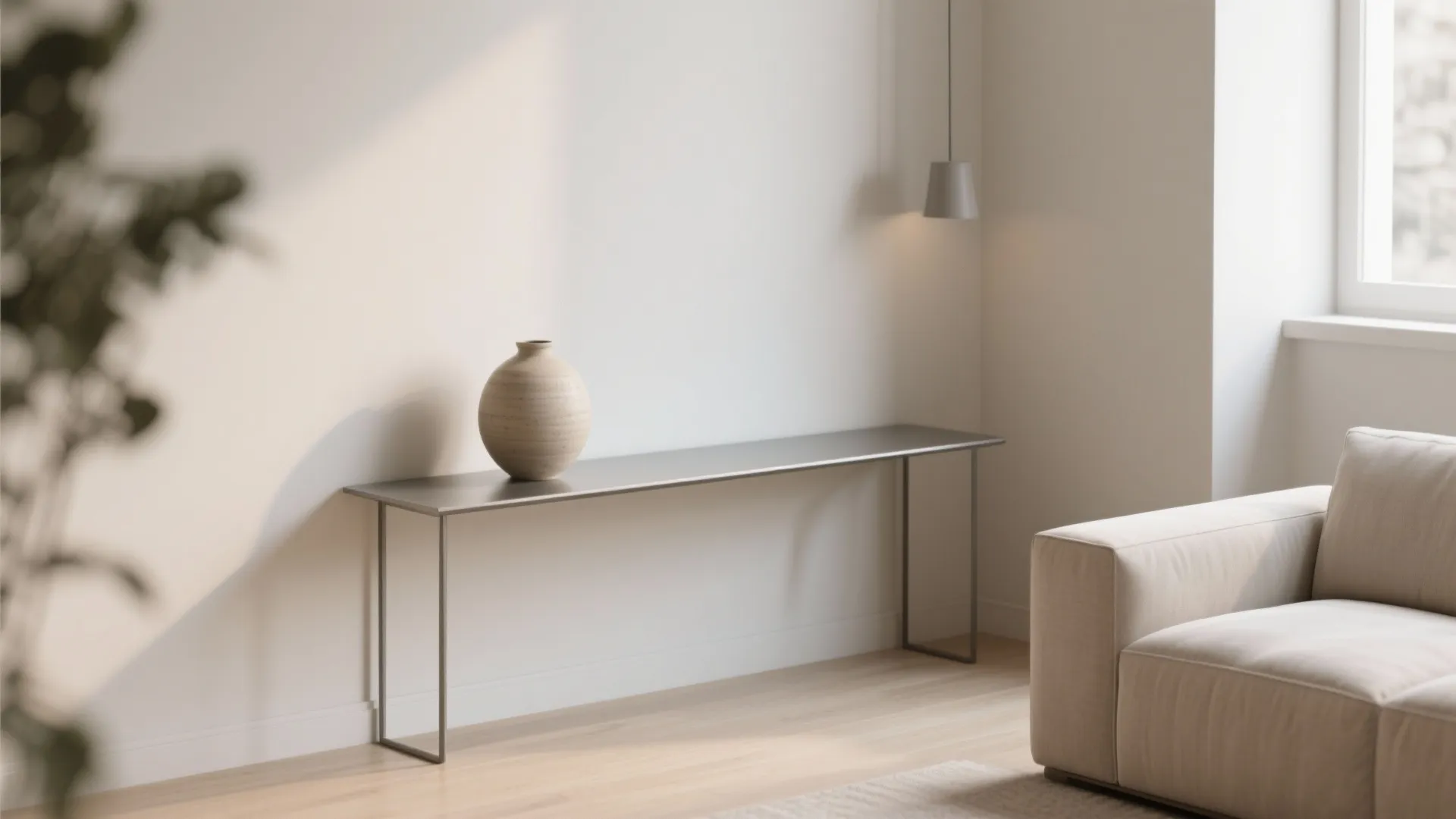 Minimalist console table with ceramic vase in neutral-toned living room
