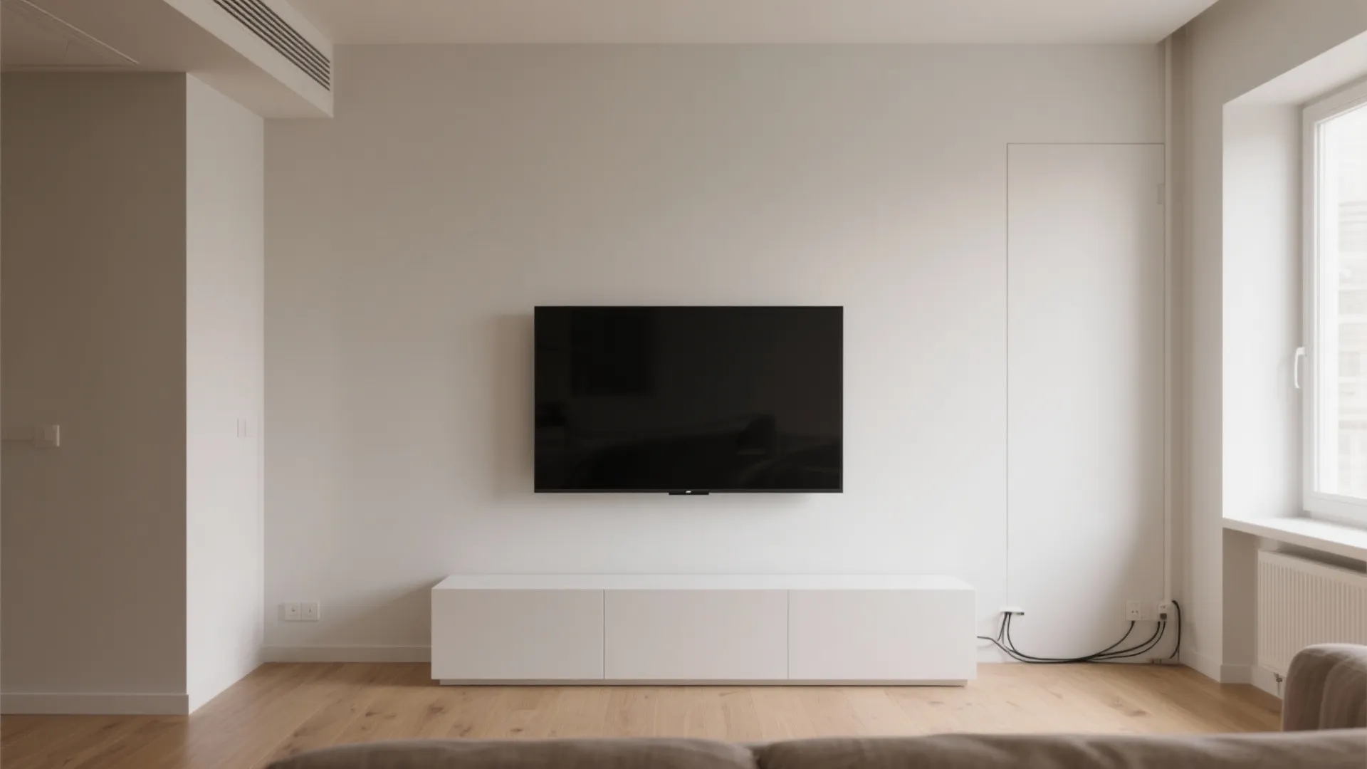 Minimalist living room with floating TV console and neutral tones