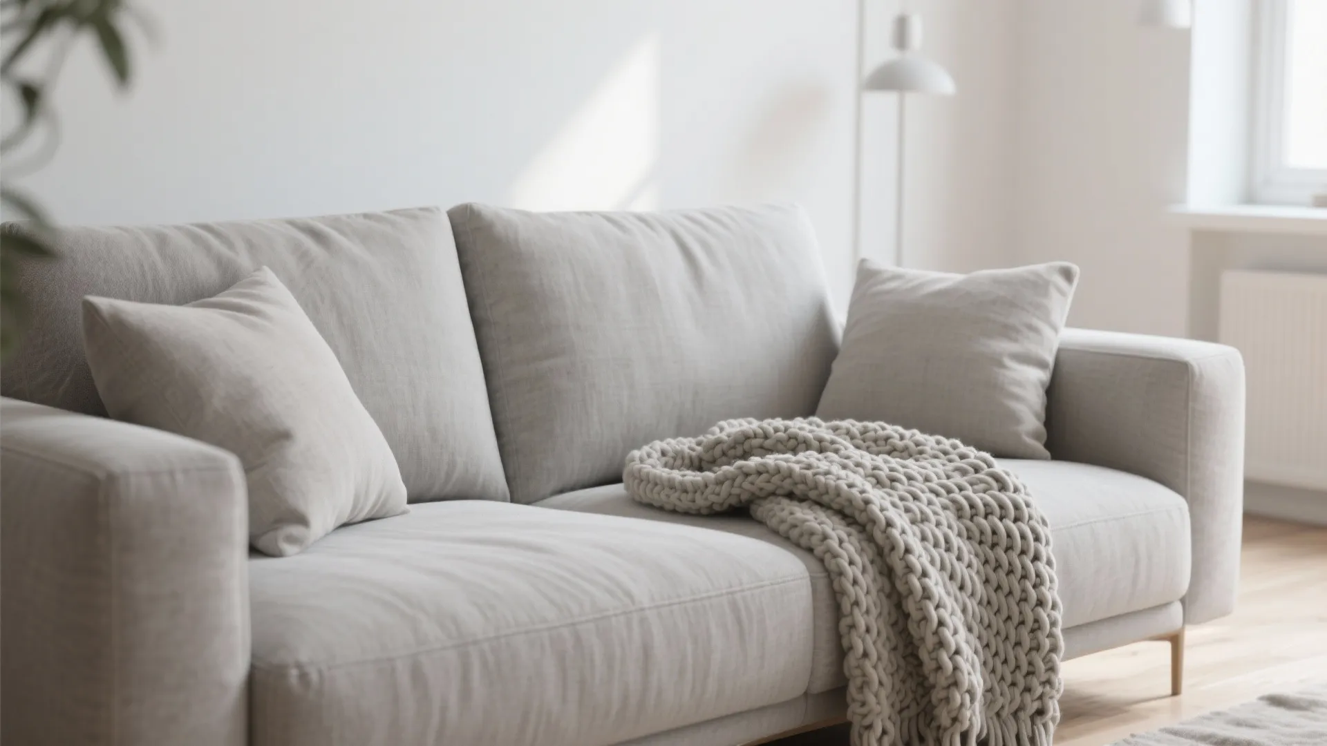 1. Minimalist Grey Couch with Layered Textures