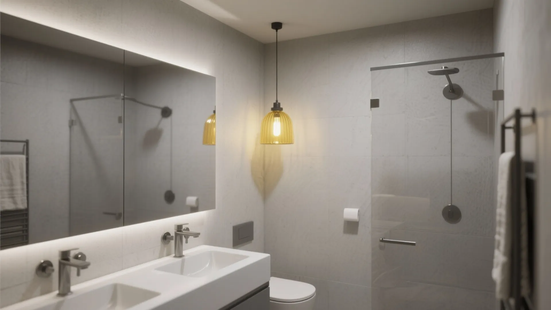 Grey minimalist bathroom with double white sink large mirror toilet and a hanging yellow light