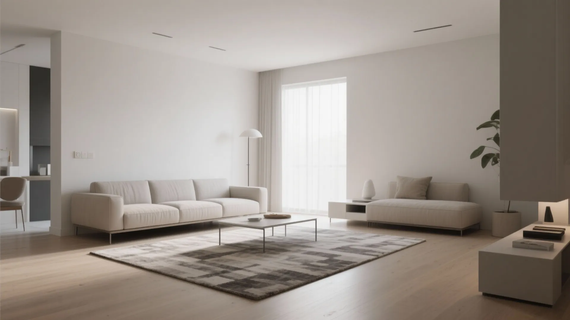 Minimalist white living room featuring a long sofa, coffee table, grey rug, and floor lamp