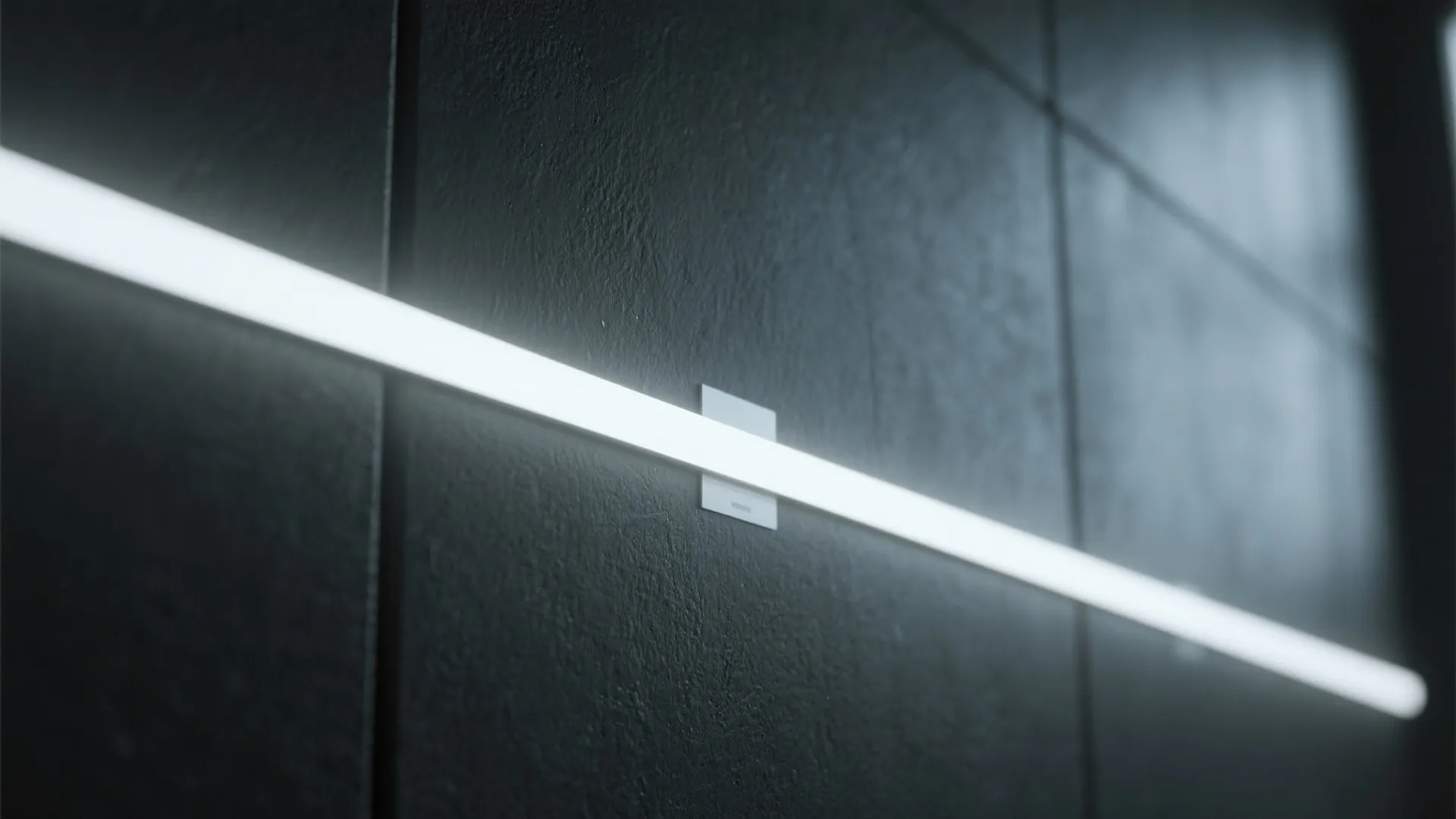 Minimalist bright light strip mounted horizontally on a dark textured wall panel in a modern room