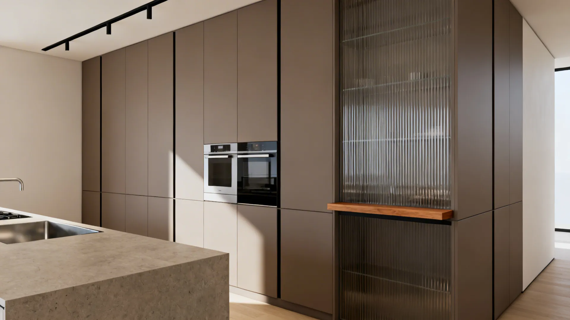 Handleless matte slab cabinets and full-height storage create a calm minimalist galley kitchen.