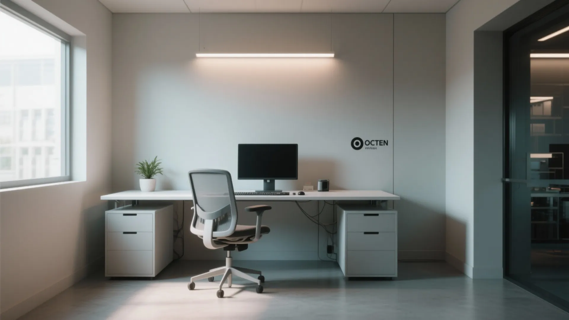 Minimalist office workstation with white desk grey mesh chair single monitor and bright window natural light