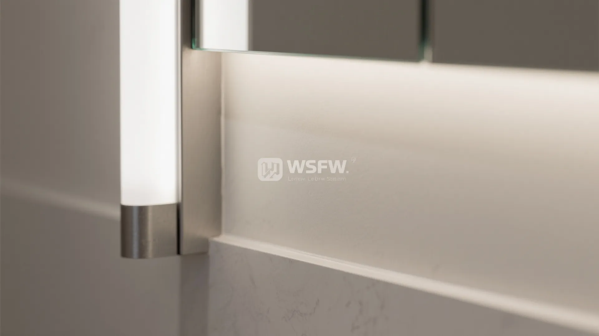 Close-up of vertical LED light and trim on a recessed mirror cabinet.