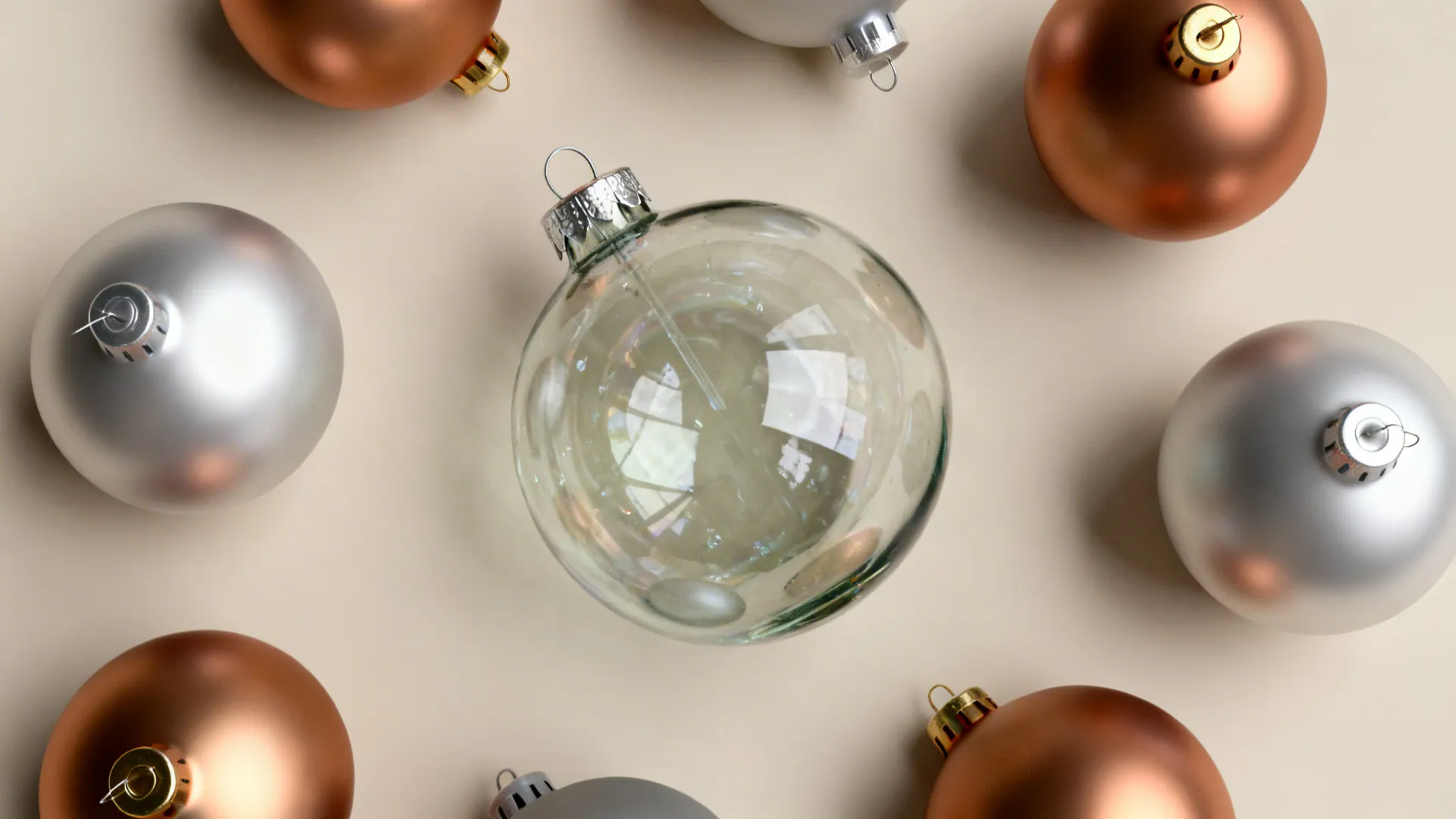 Arrangement showing one high-end ornament paired with matte plastic baubles for budget impact