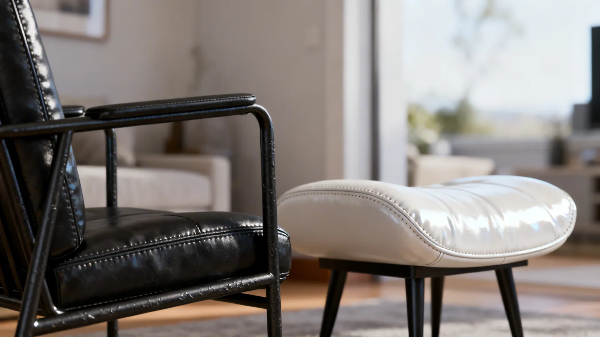 Close-up of matte black metal frame chair beside a glossy white leather slipper chair showing contrasting finishes.