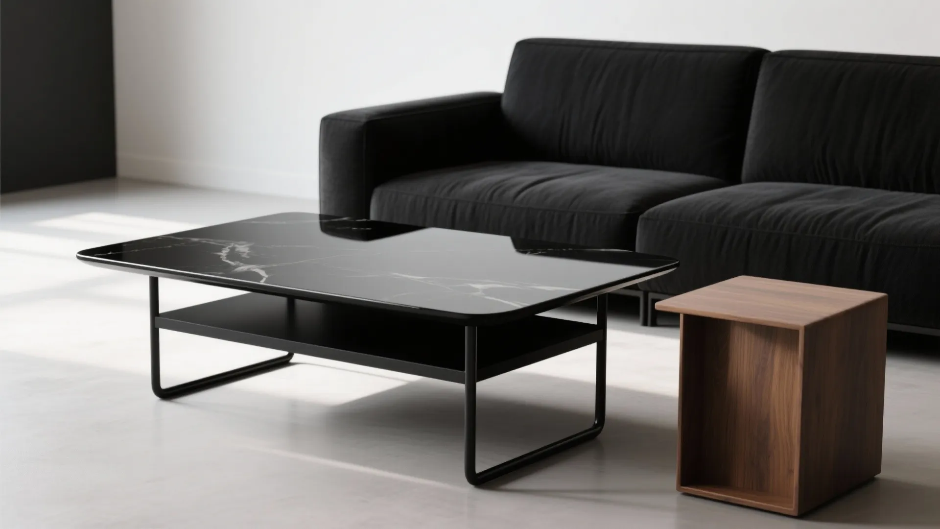 Contrasting black finishes: matte upholstery, glossy coffee table, and black metal legs with warm wood accent.