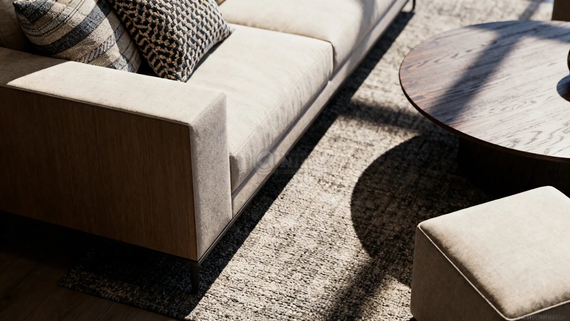 Close-up of sofa, round coffee table, and square pouf showing mixed shapes and textures.