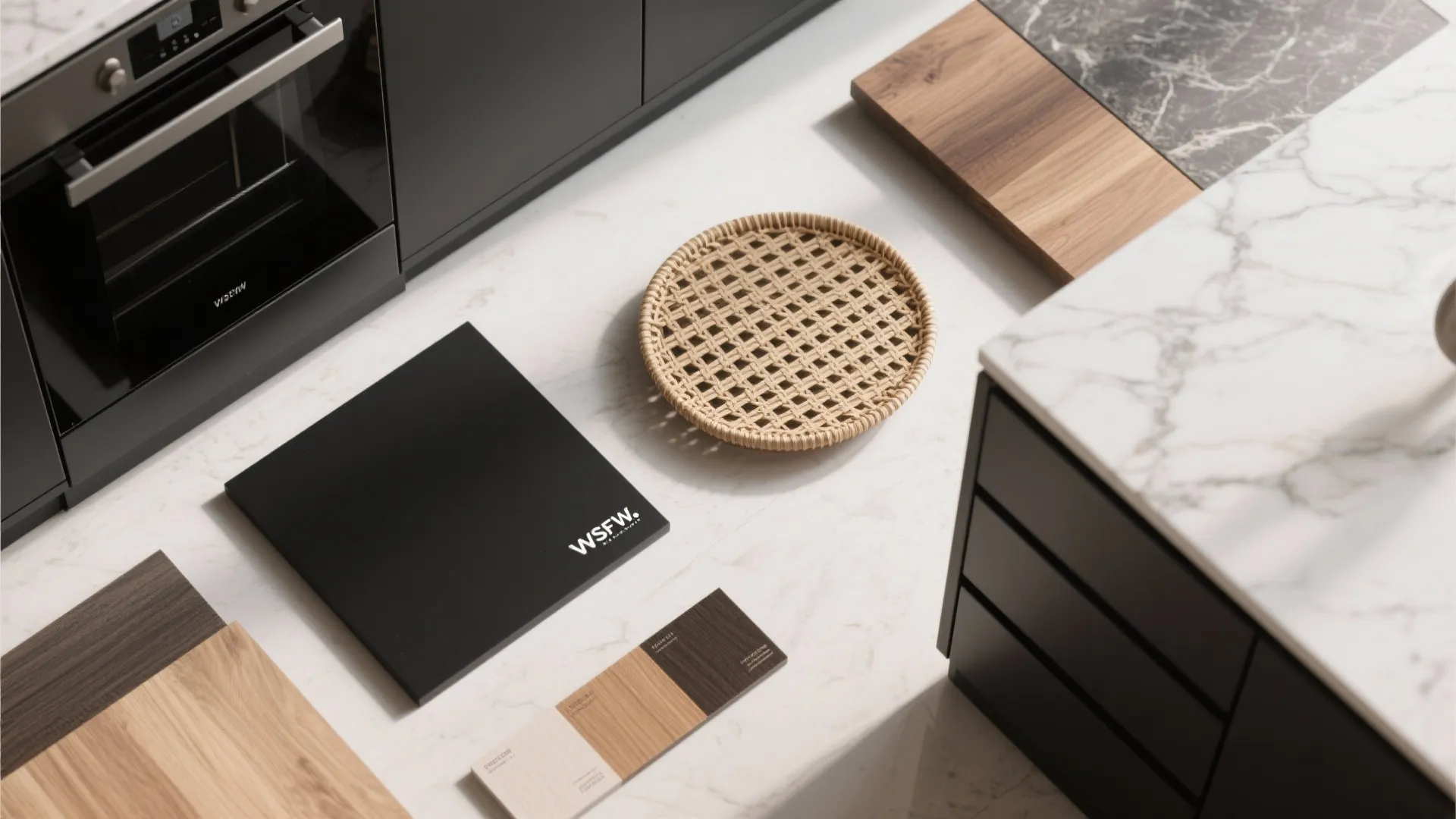 Close up view of wood stone and woven samples laid out on a white marble countertop