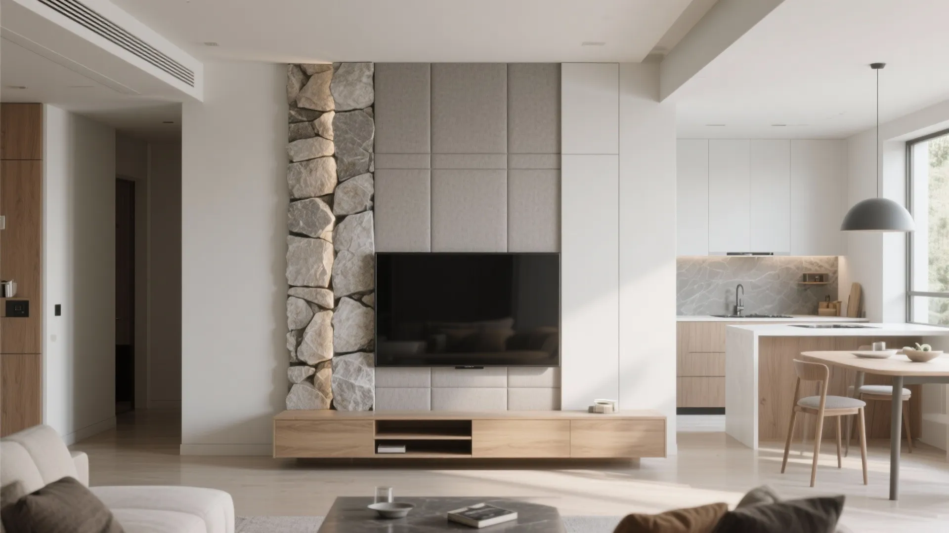 Modern living room featuring a stone wall accent beside a television and wooden storage cabinet