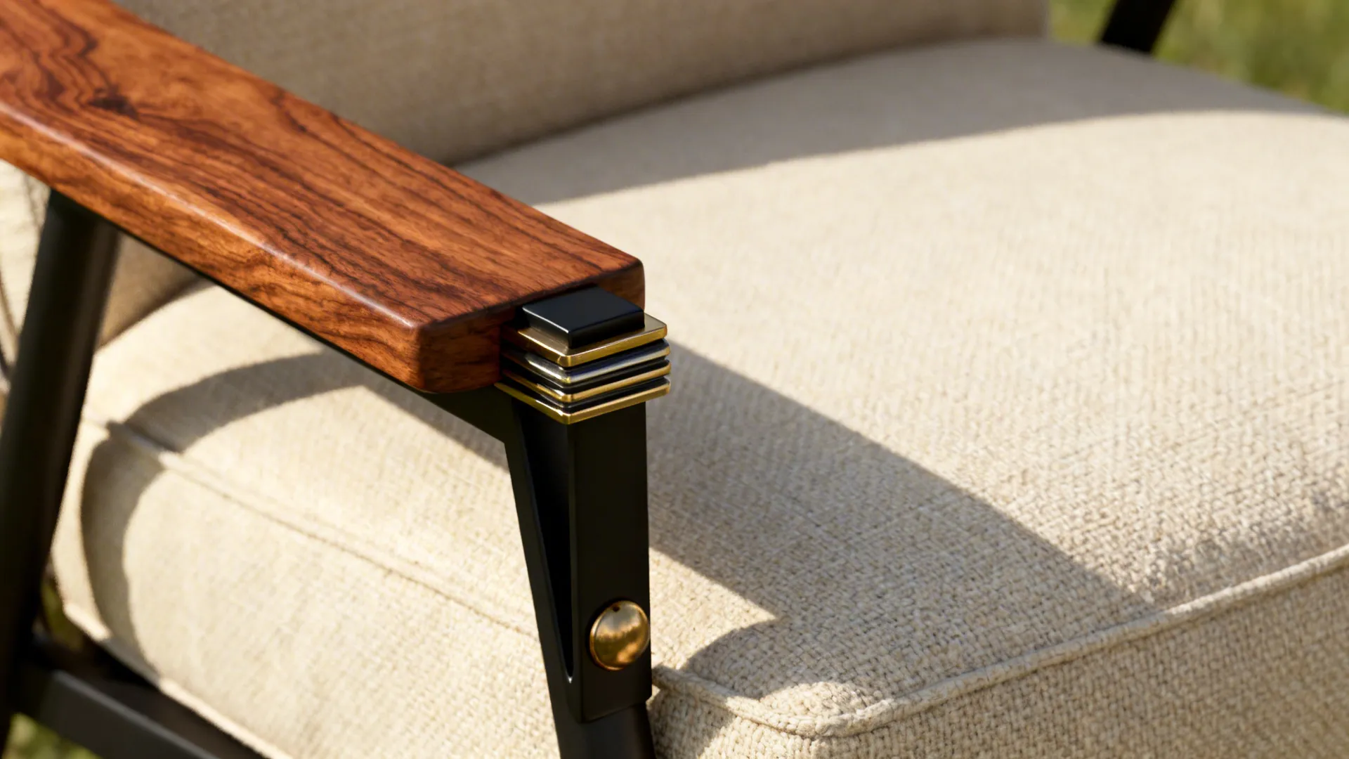 Close-up of brown timber, cream linen cushion and mixed metal hardware.
