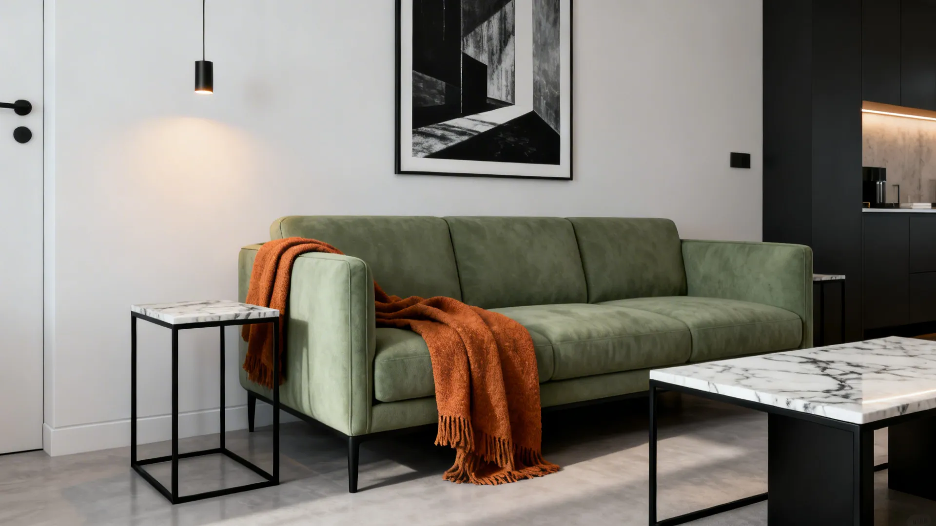 Modern minimalist living room with a sage sofa, black metal accents and marble details.