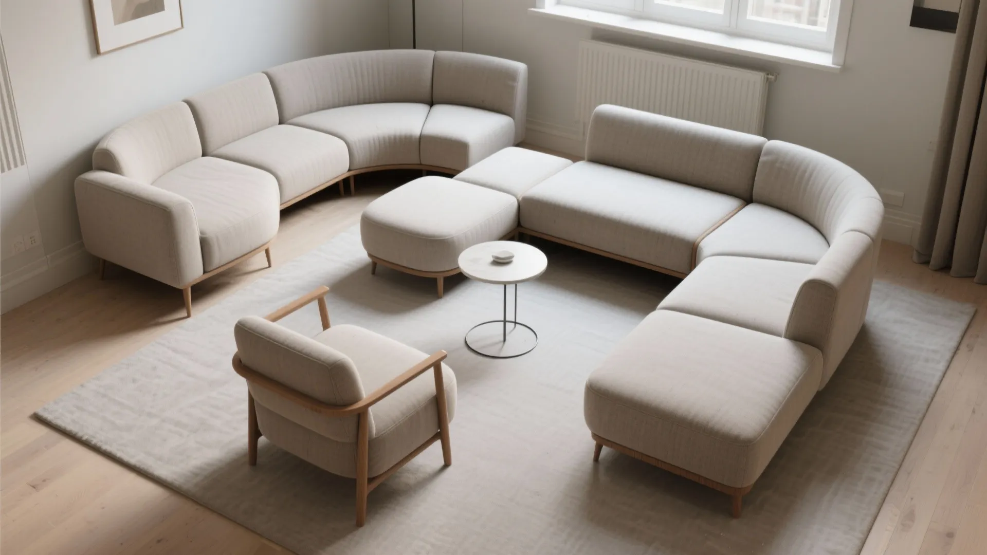 Modular cream sofa arrangement in a living room with a small table and matching armchair