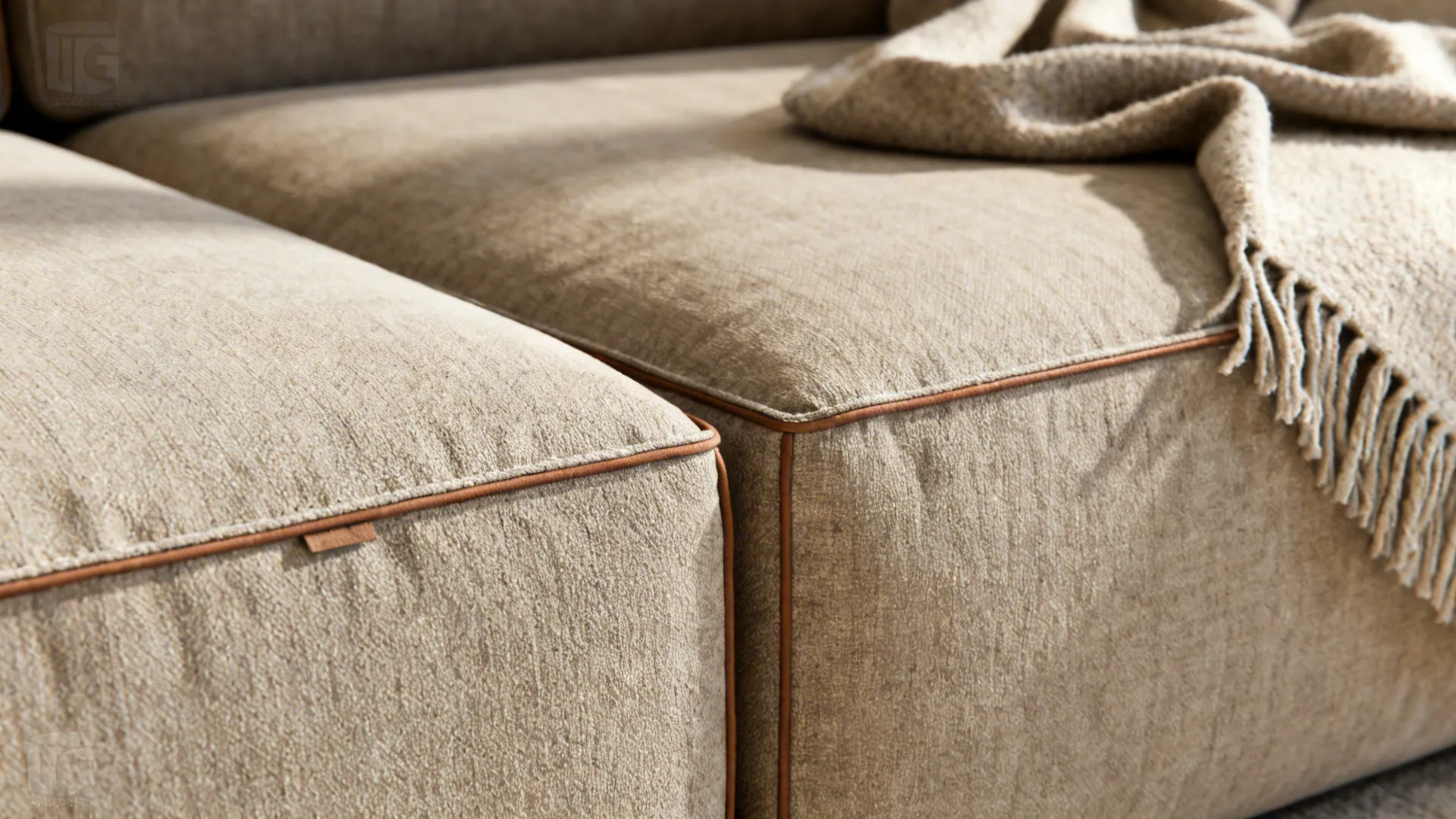 Close-up of a modular sofa corner with washable performance fabric and removable chaise.
