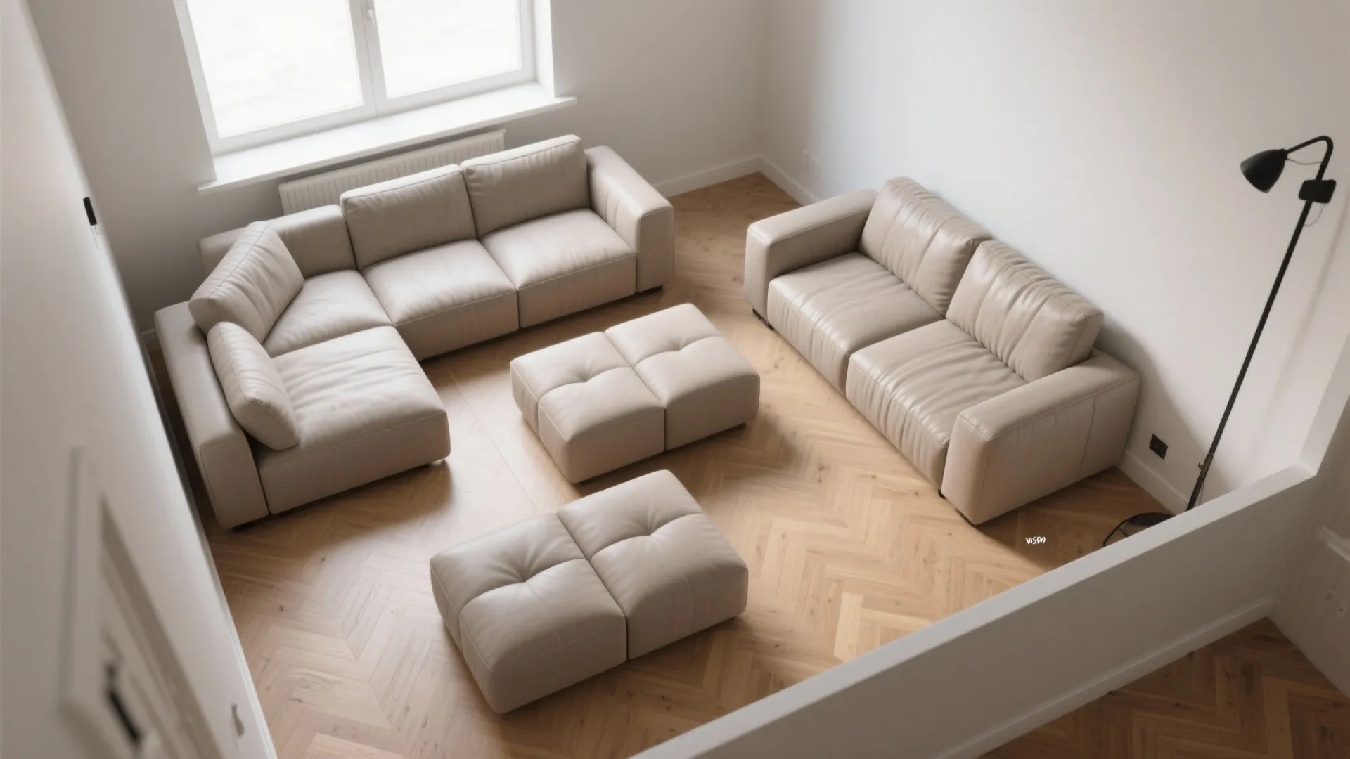 Modular beige leather sofa set with matching footrests on wooden floor in bright sunny room