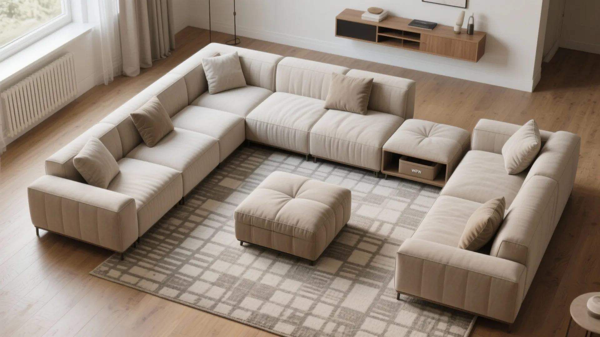Top down view of modular beige sofa on plaid rug with footrest and wood floor