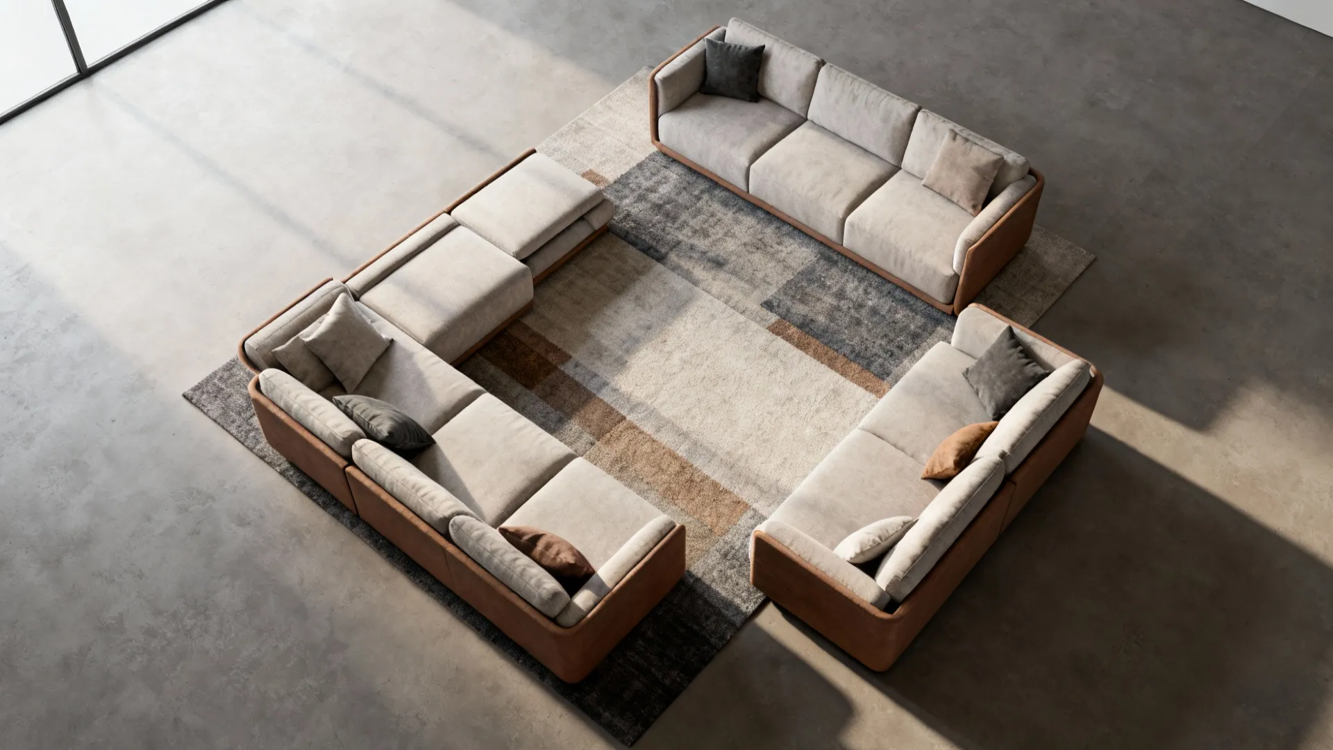Top view of a modular sofa arrangement on a large rug in a modern room