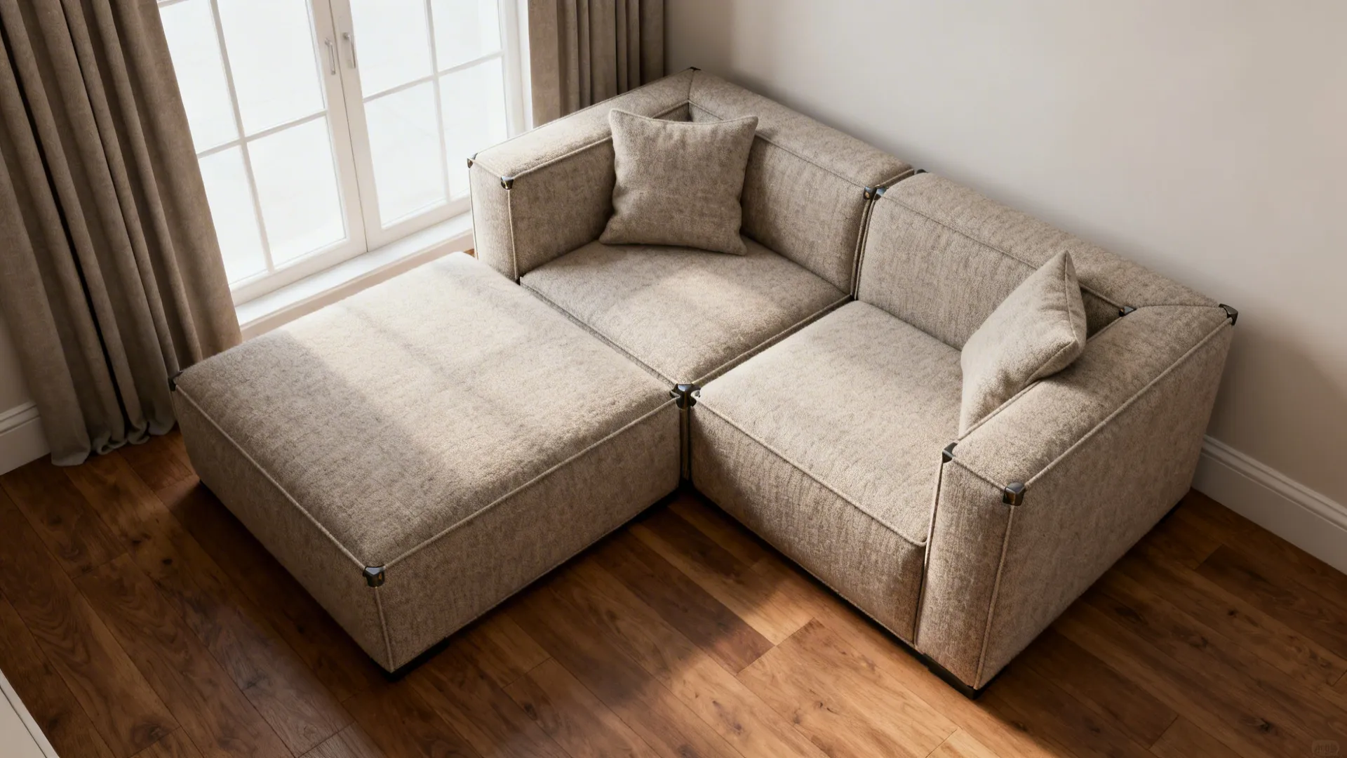 Compact modular two-piece sofa with chaise shown in a small living room layout from a top-down angle