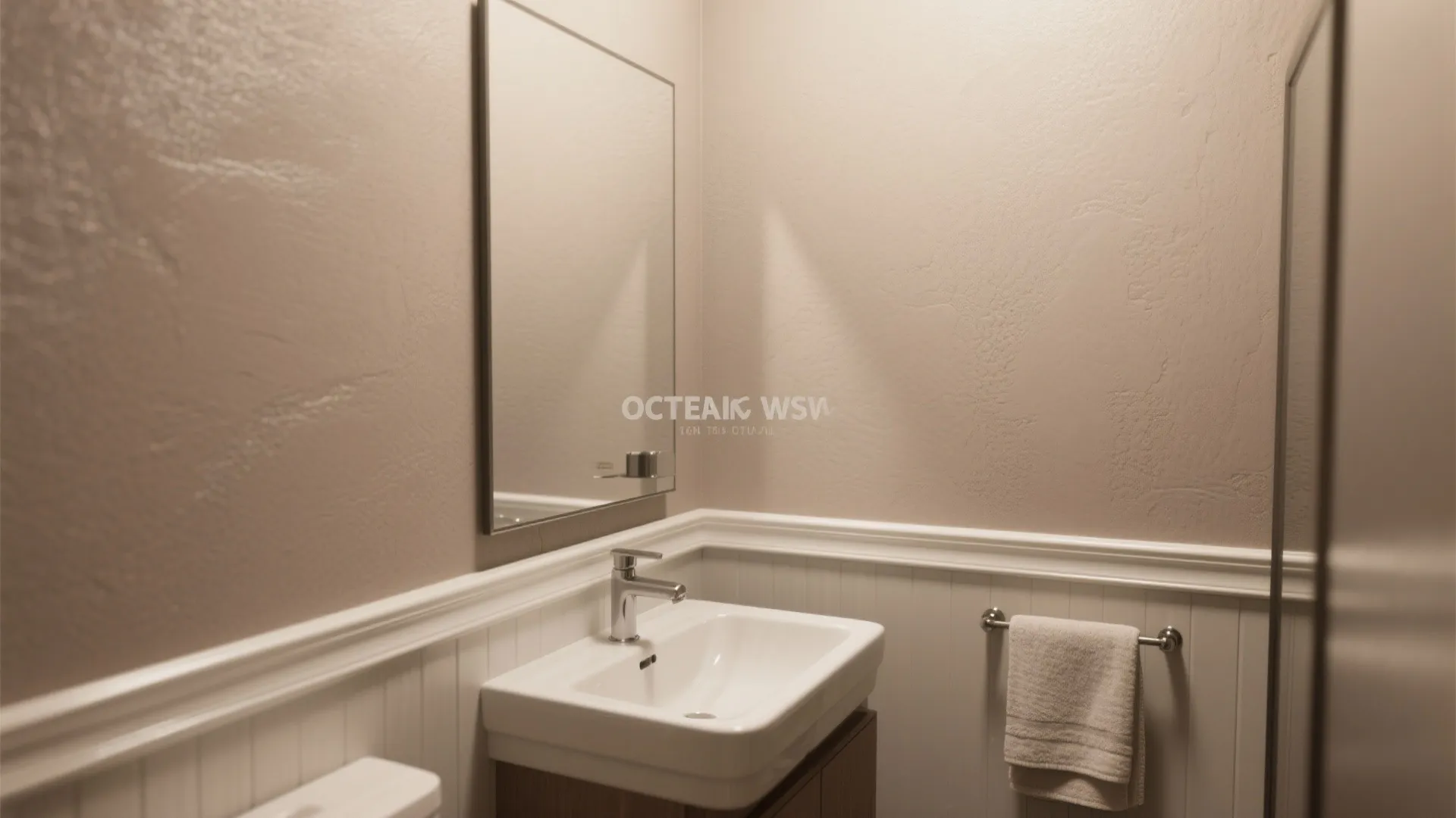 Minimalist bathroom interior featuring white sink wooden cabinet mirror towel rack and warm wall lighting