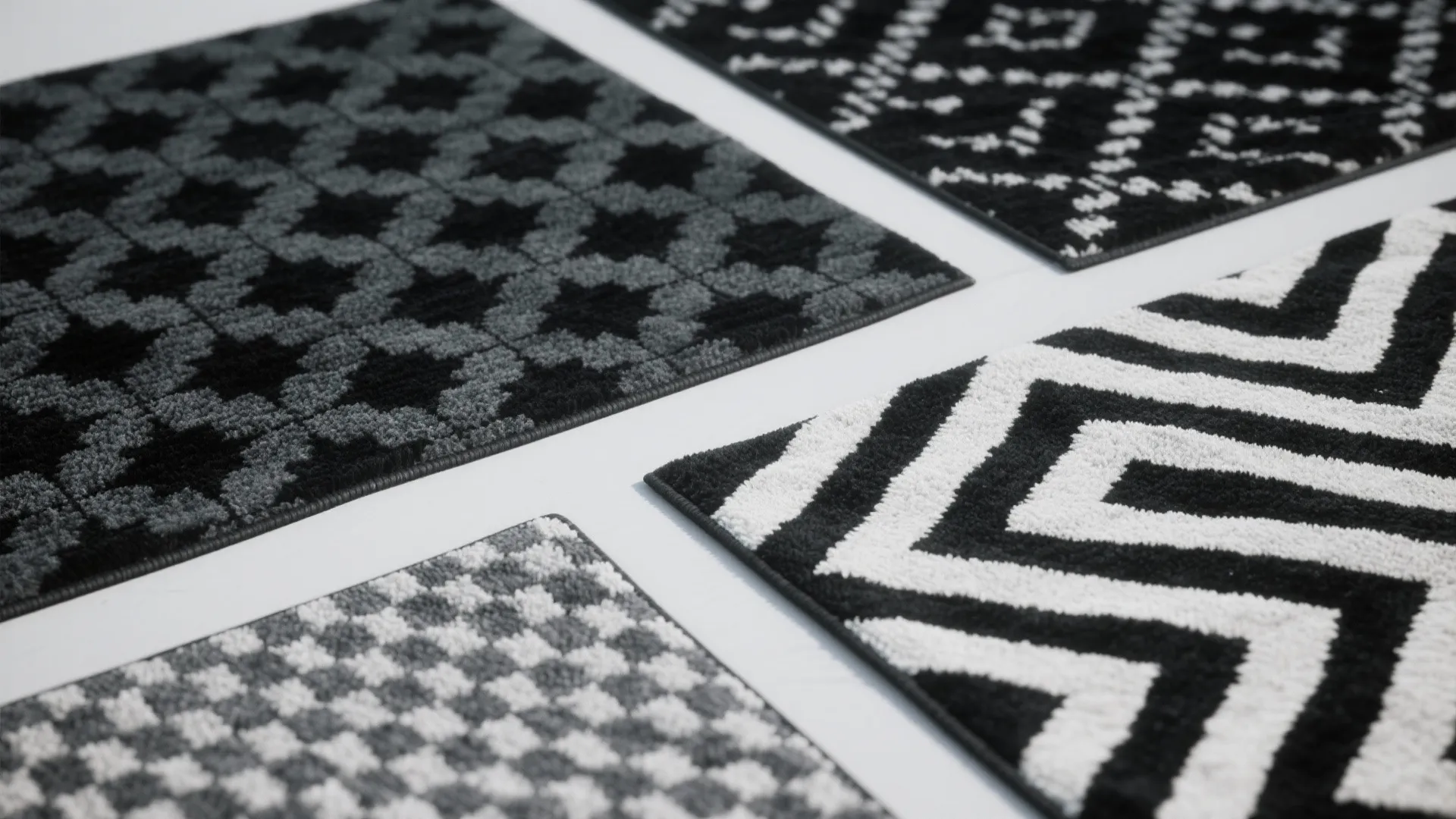 Monochrome patterned rugs with geometric designs
