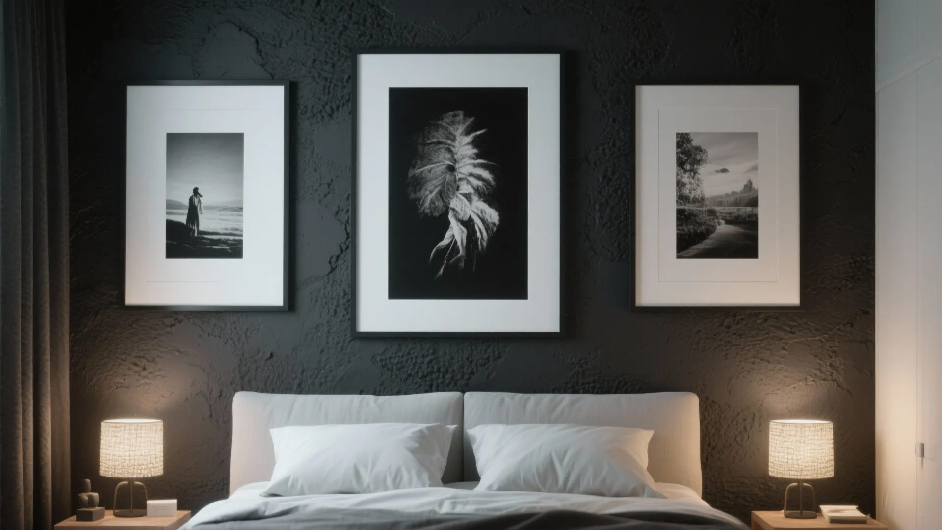 Modern dark bedroom with three framed wall pictures above white bed and two table lamps