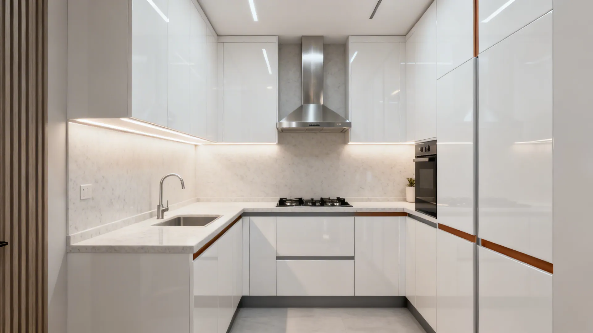 Monochrome white acrylic kitchen with pale quartz surfaces and soft task lighting.