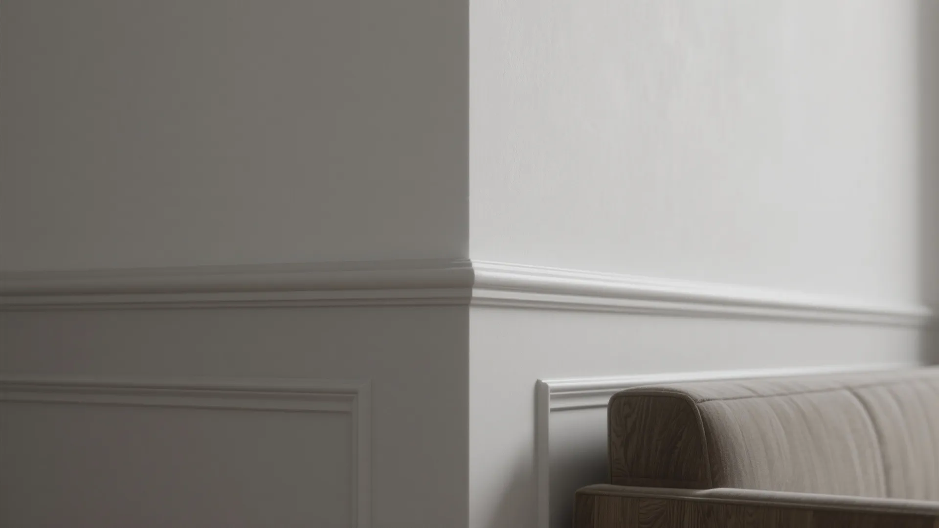 Close-up of layered paint finishes showing matte, eggshell, and satin textures in a monochrome scheme.