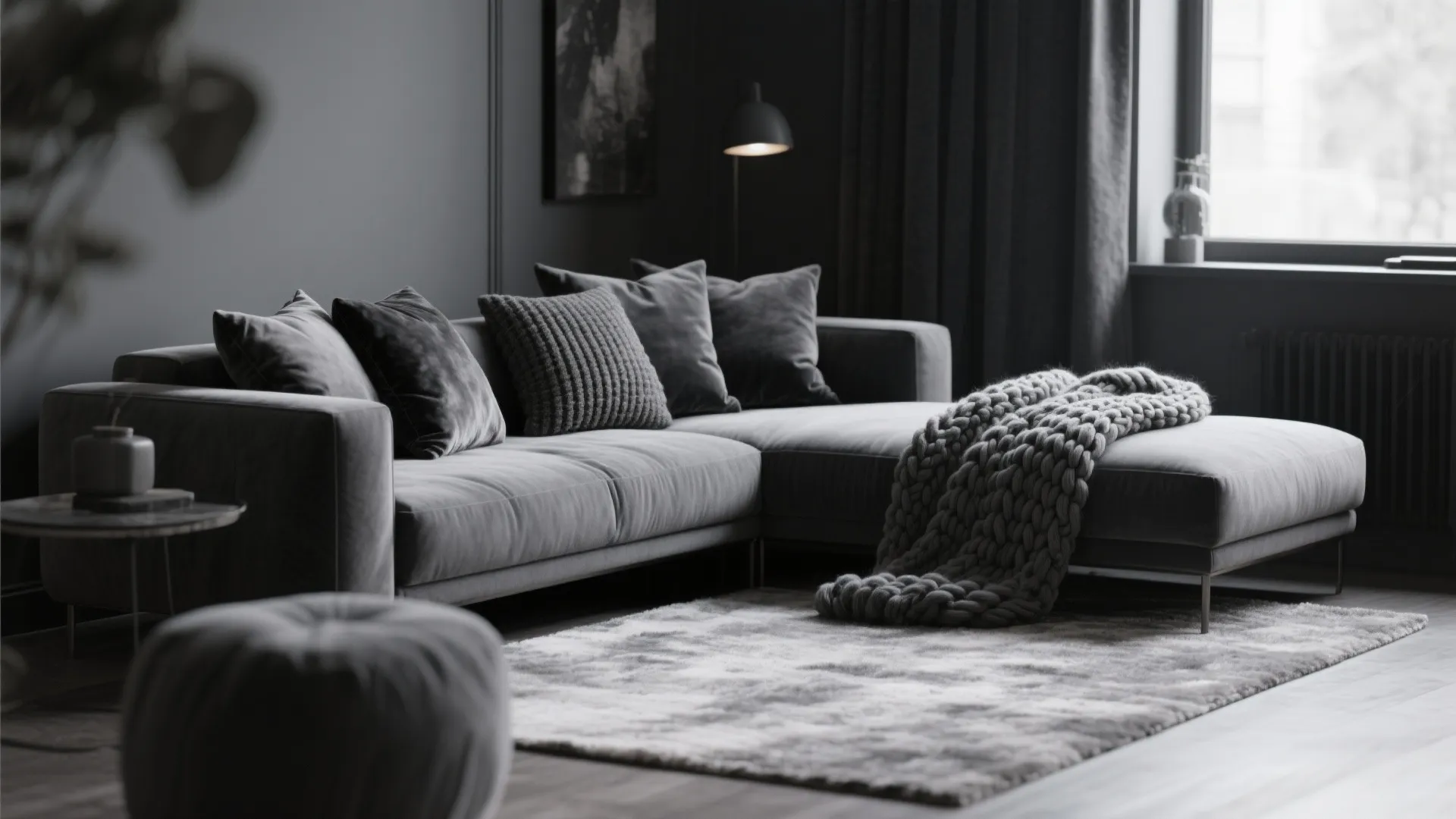 Monochrome living room with layered textures in deep gray