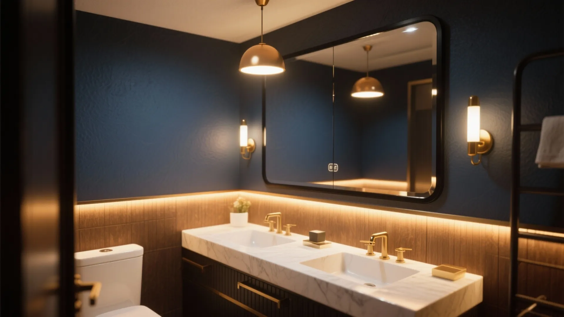 Vanity area with layered warm lighting and a reflective black-framed mirror