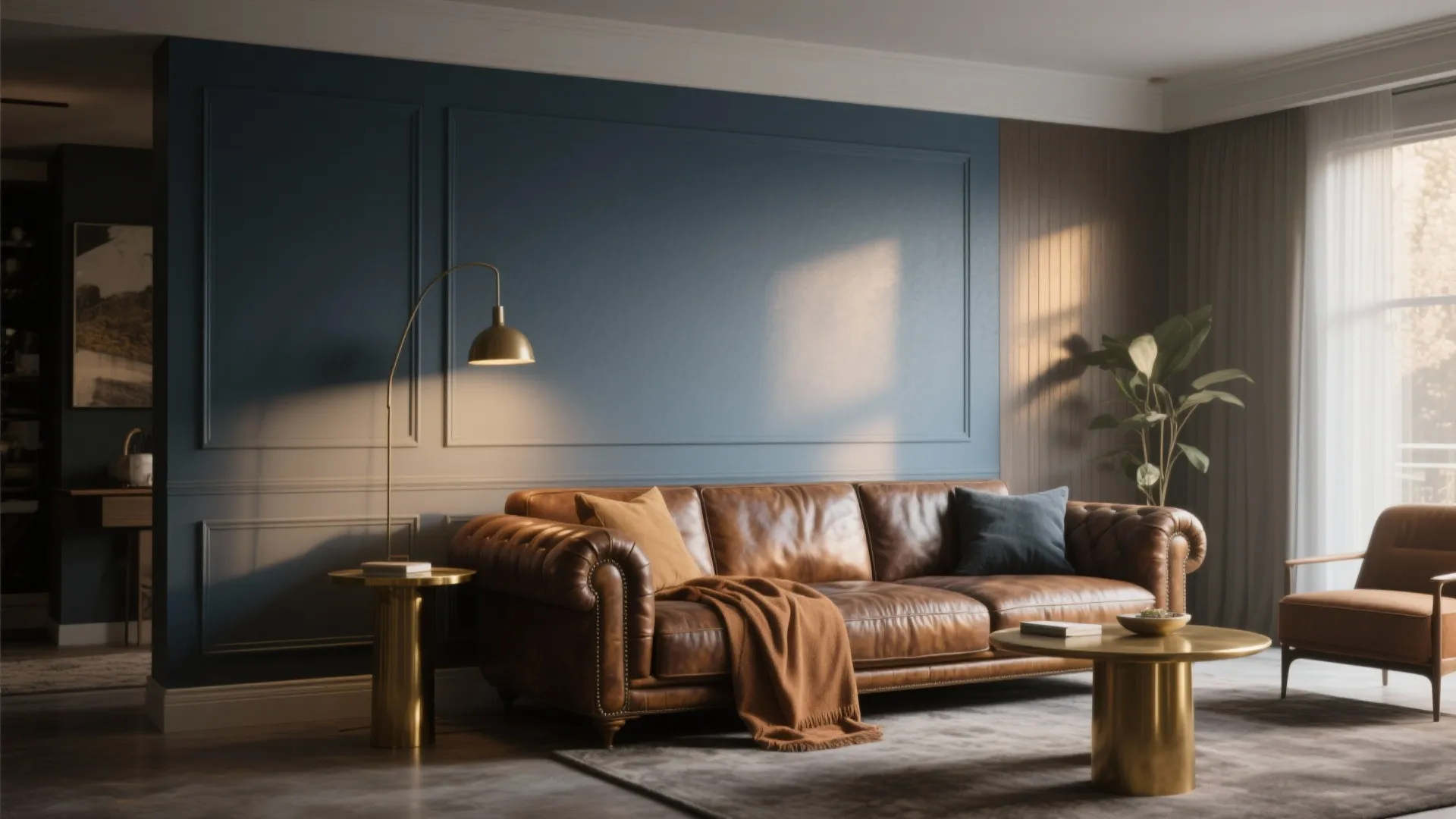 Elegant living room featuring blue wall paneling with brown leather sofa and gold coffee tables