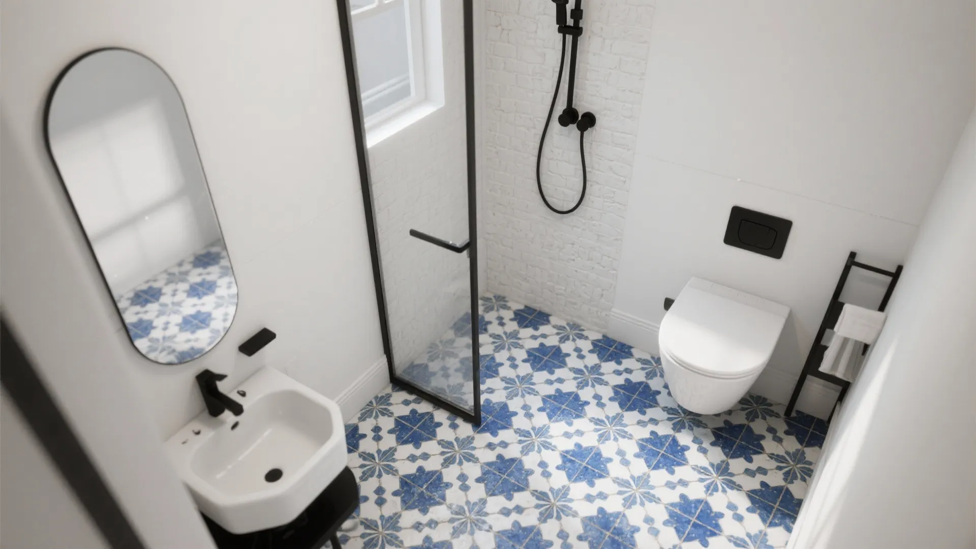 Top view of a bathroom with blue patterned floor tiles white sink toilet and shower