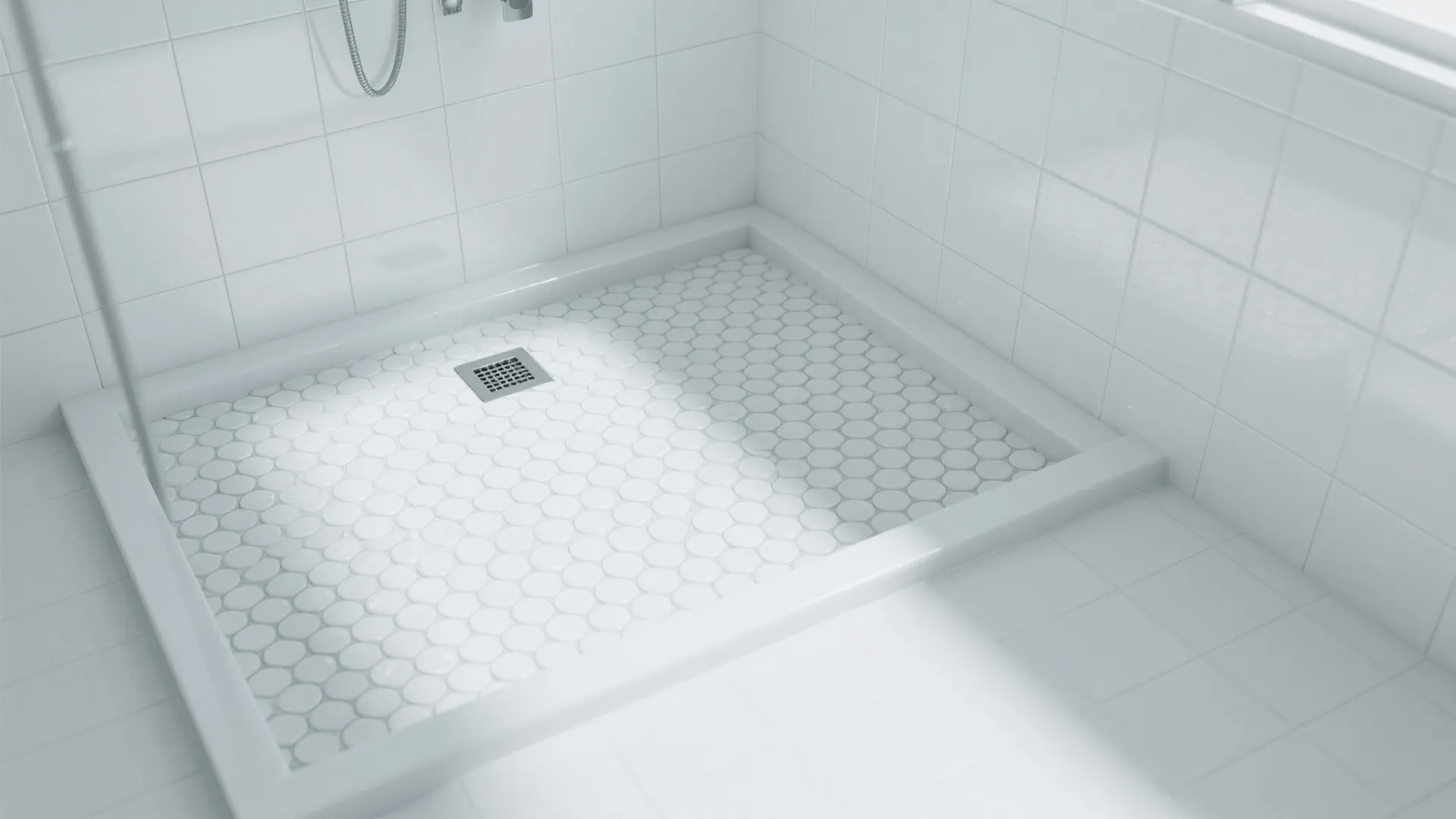 Top-down view of white mosaic shower floor with centered drain and satin wall tiles.