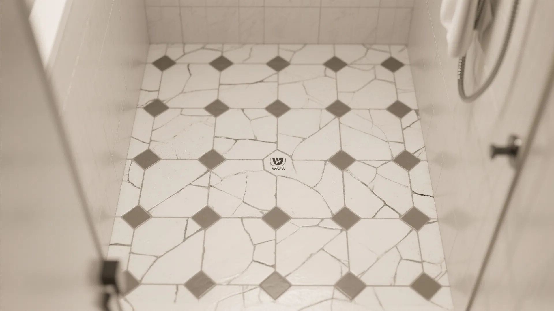 Top-down view of matte hex mosaic shower floor with aligned sheets and spacers.