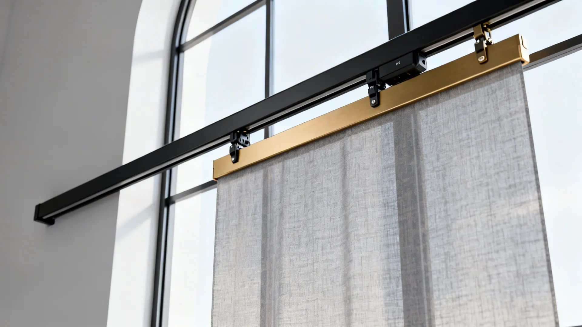 Slim black motorized curtain track and hardware detail above a living room window.
