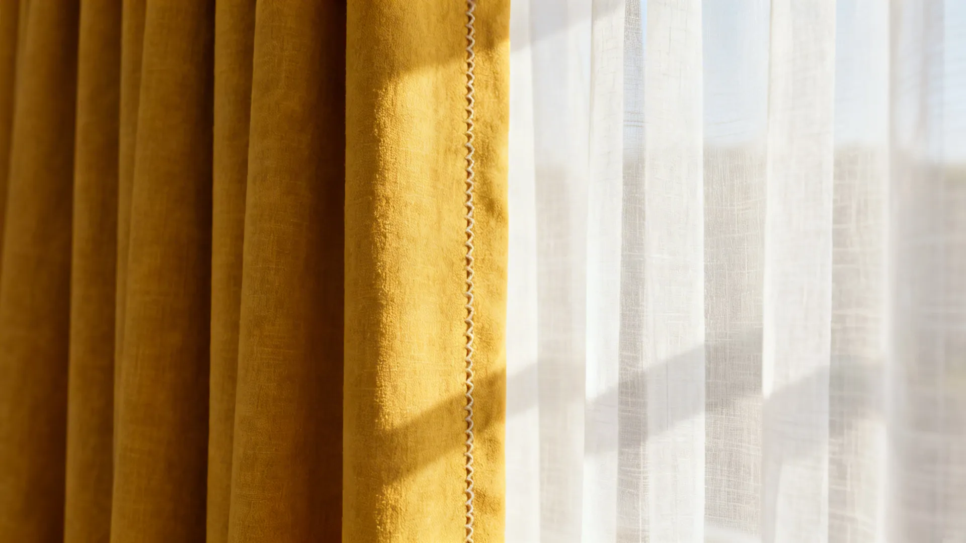 Close-up of mustard curtain layered with white sheer showing fabric texture