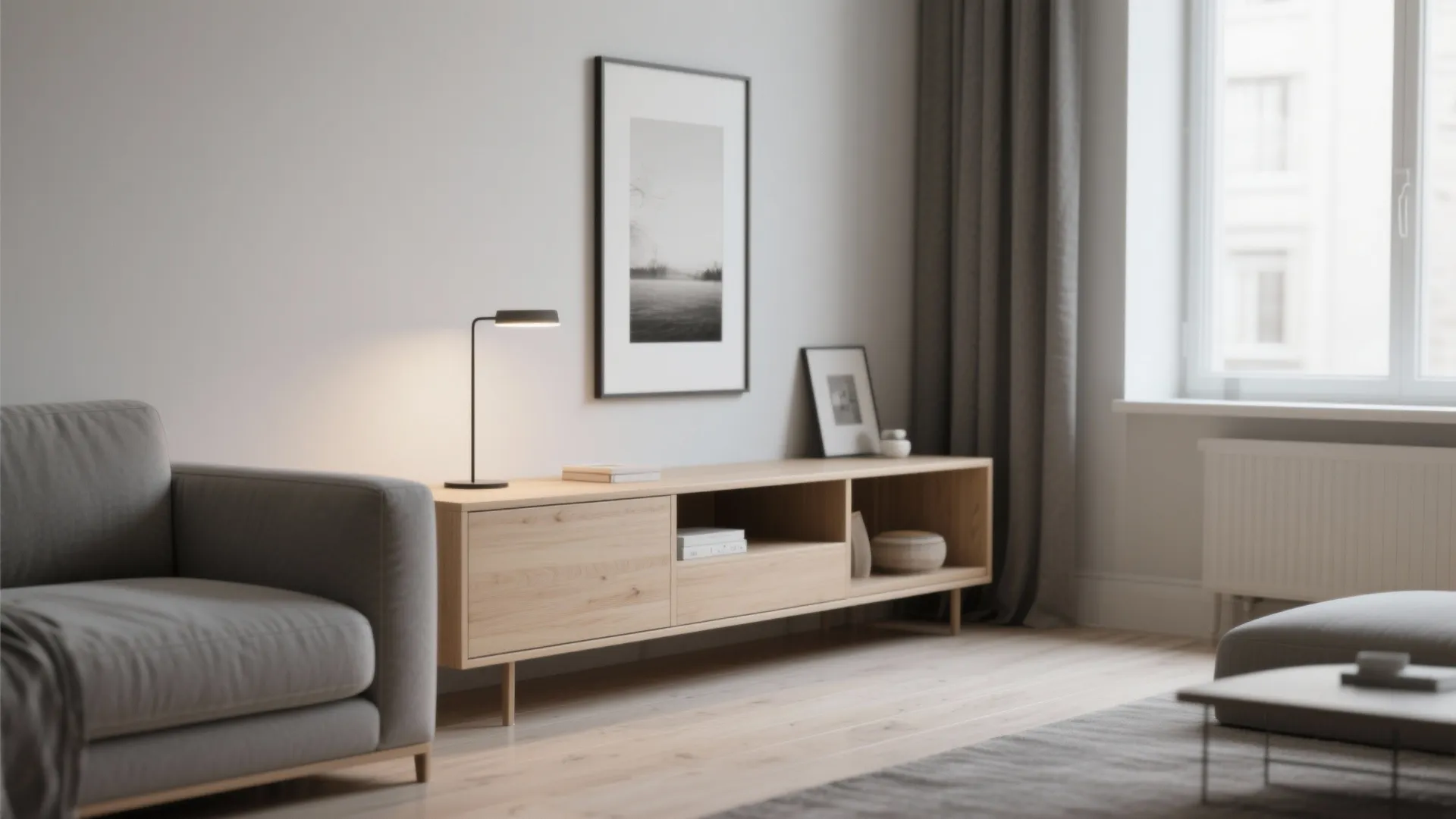 Modern living room featuring a wooden cabinet with lamp and grey sofa on wooden floor