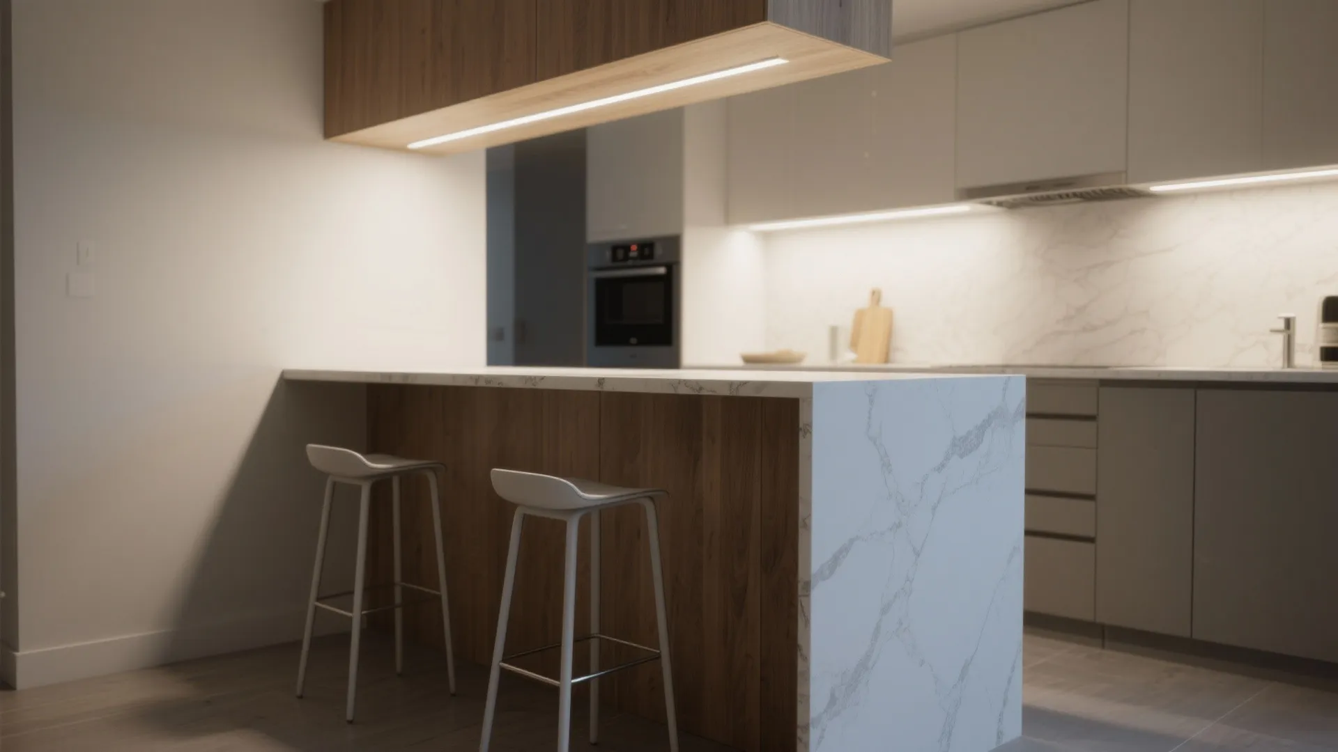 Narrow 48-inch island with two slim stools tucked under a small overhang in a galley kitchen.