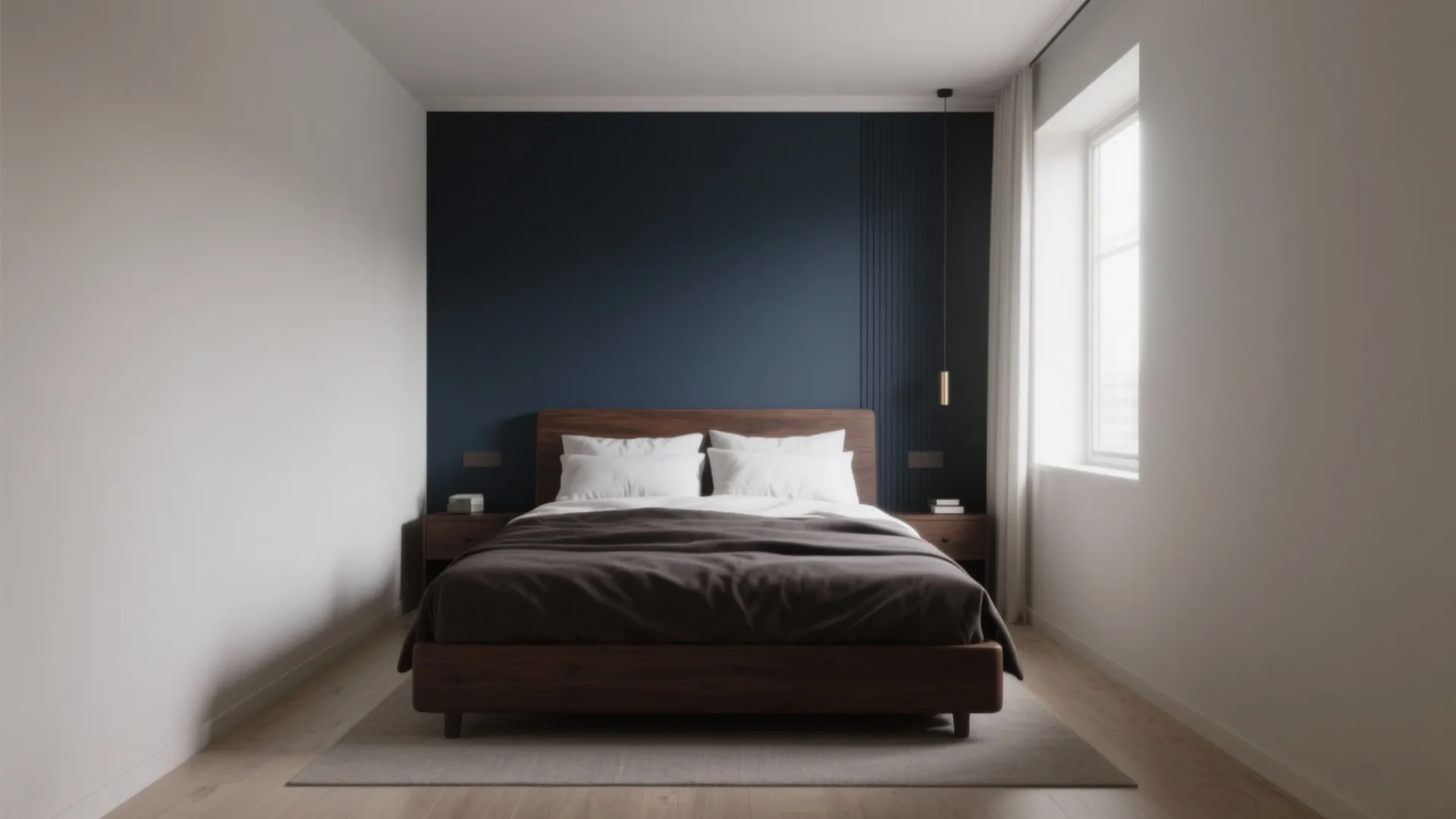 Dark brown bed against a matte navy accent wall