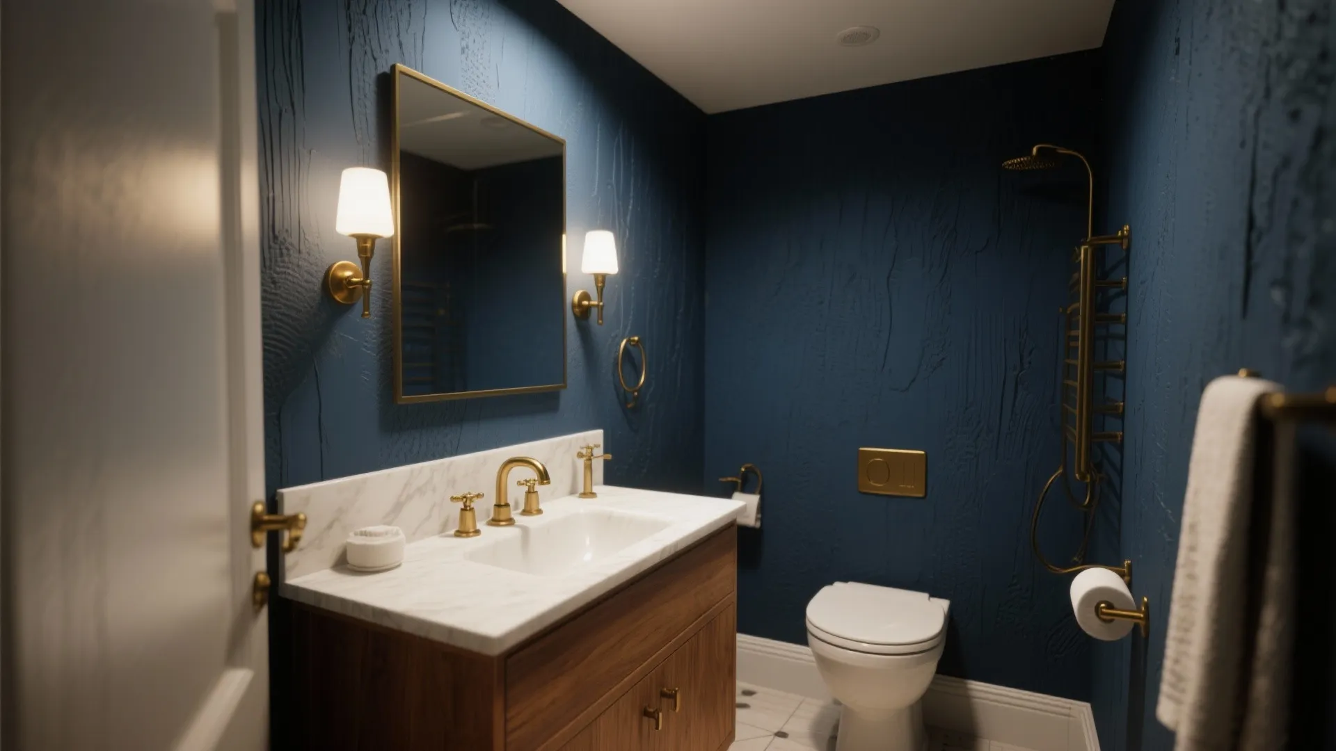 Compact bathroom with a deep navy accent wall behind a wood vanity and brass fixtures.