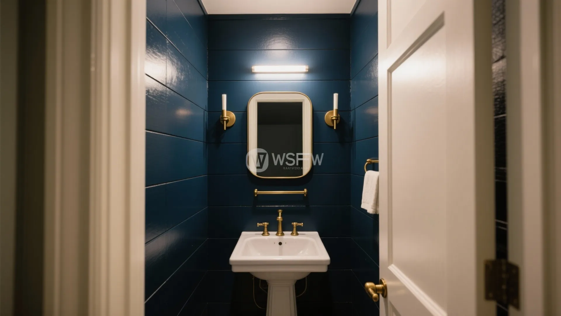 5. Bold accent wall with moody color and metal hardware