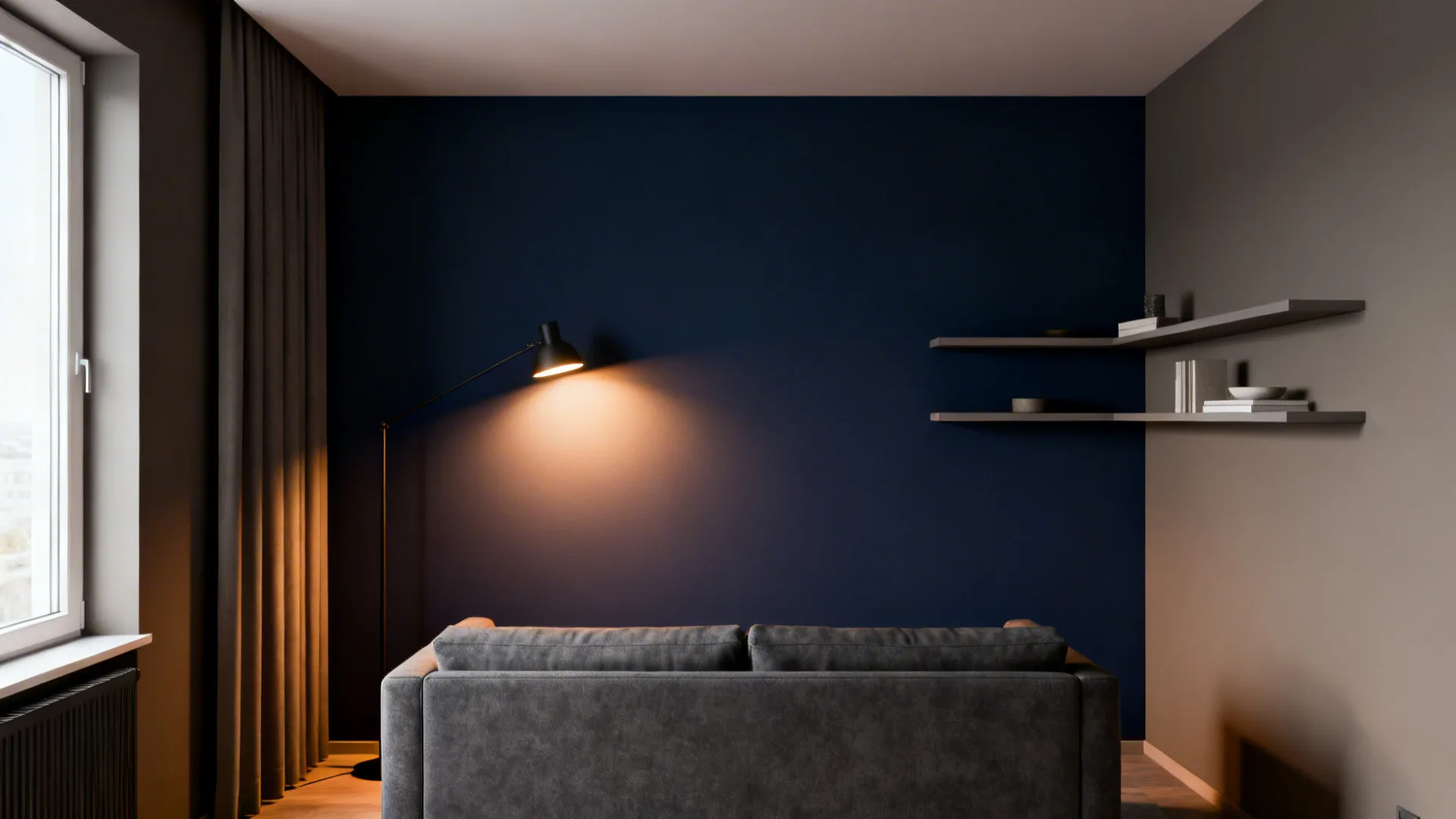 Compact living room with a deep navy accent wall and warm mid-grey surrounding walls