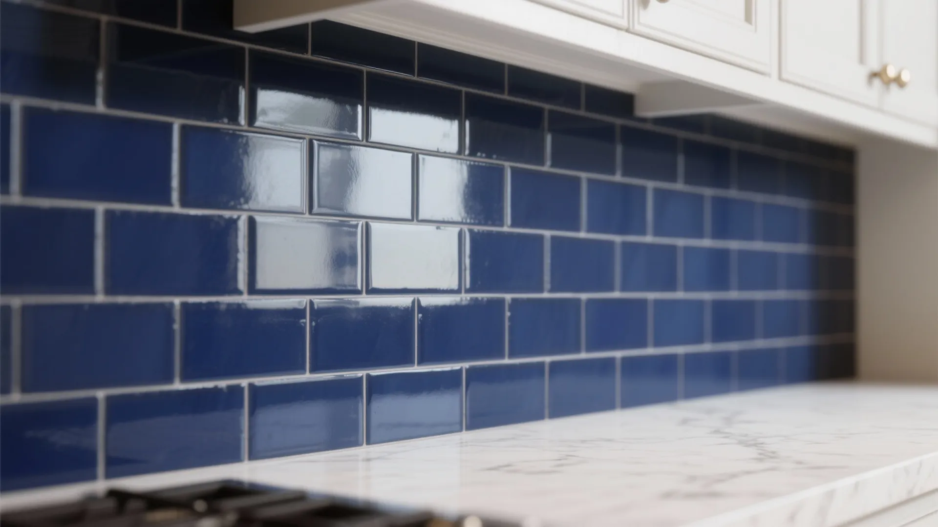 3. White shaker cabinets + navy backsplash