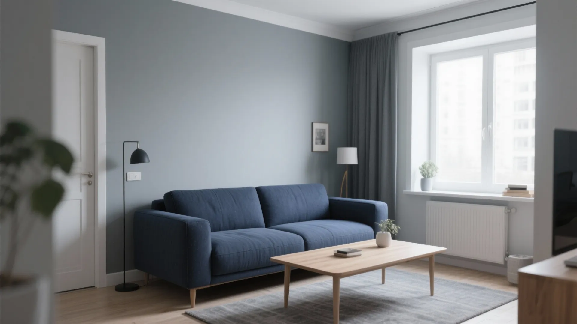 1. Minimalist Navy Sofa with Grey Walls