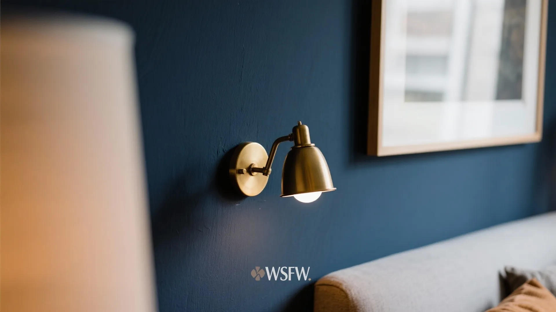 Deep Navy Accent Wall with Warm Lighting