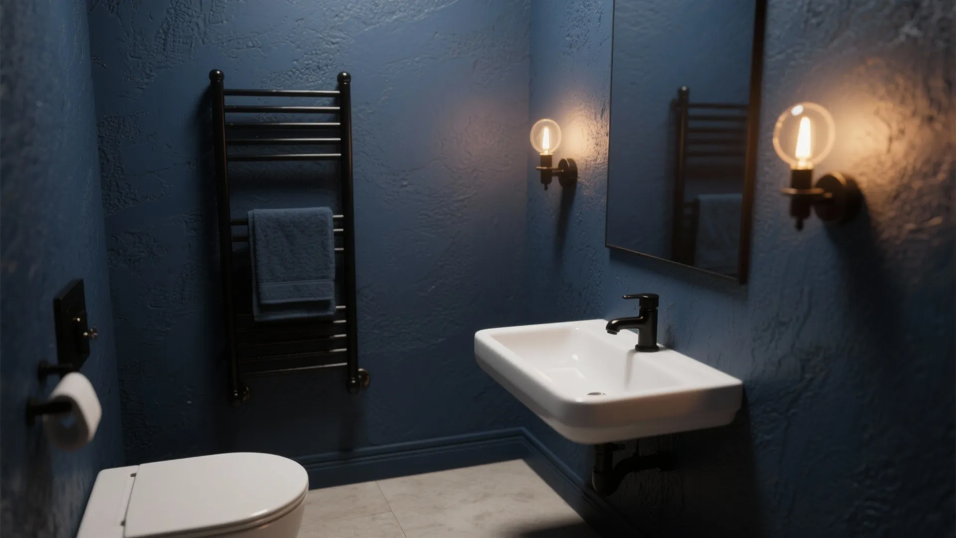 Small bathroom with deep navy walls and matte black fixtures under warm sconces