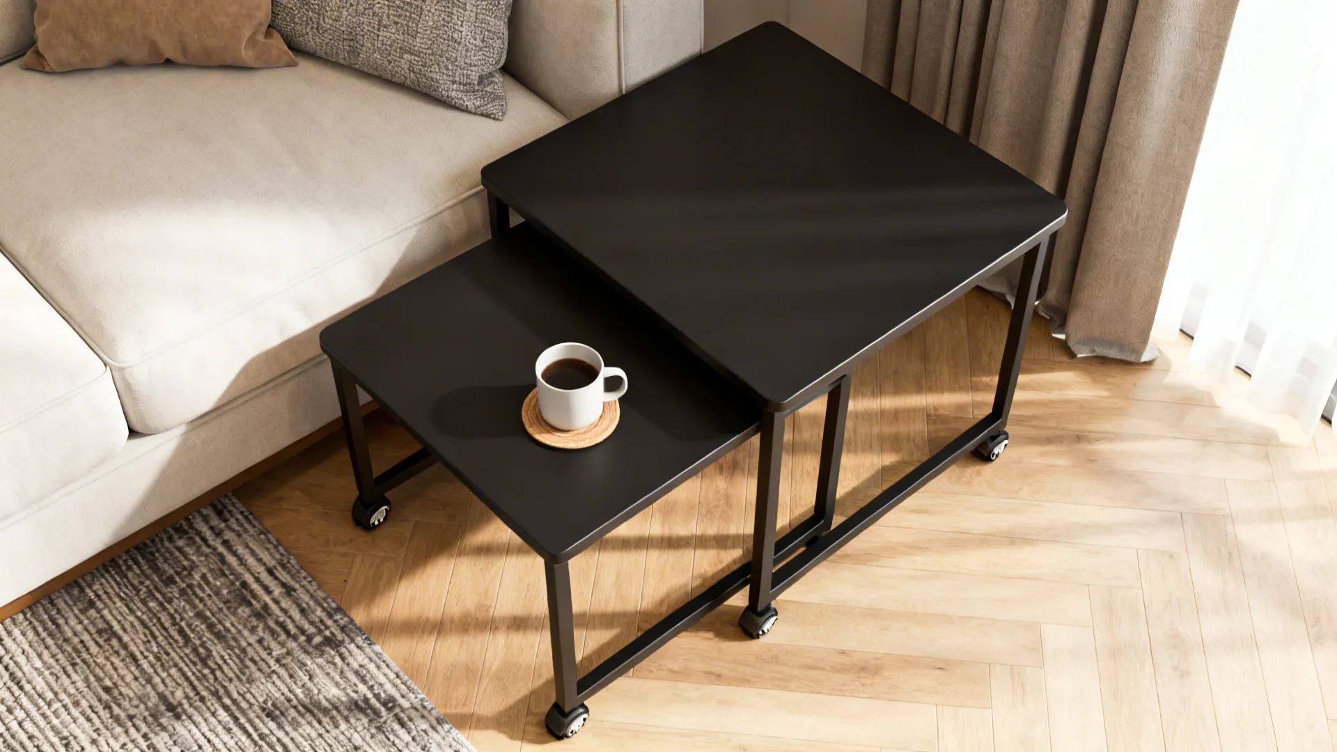Matte black nesting tables shown from above in a small living area, one table extended with a cup on top.