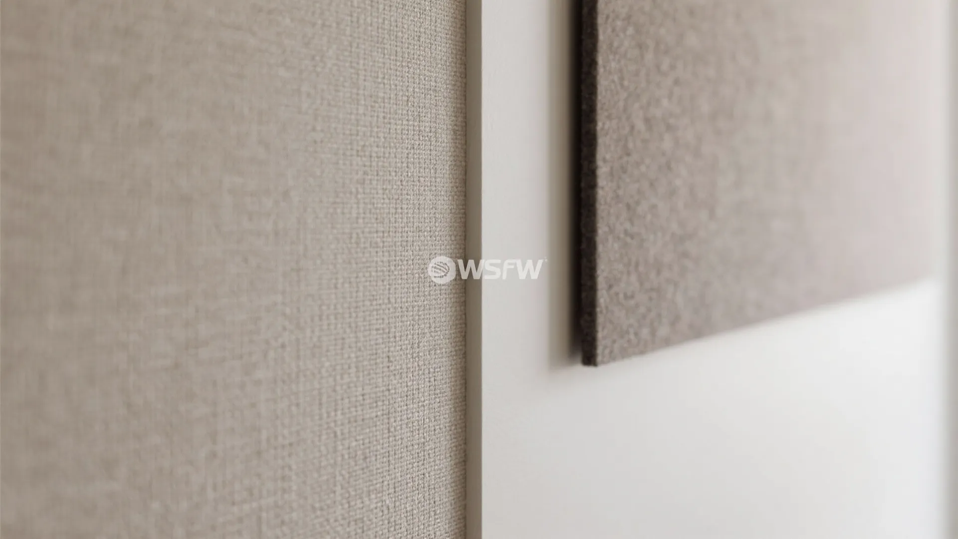Close up view of beige fabric wall panel material texture used for interior room design