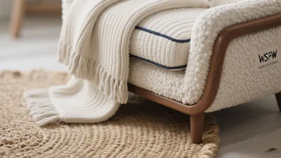 Cozy Armchair with Textured Blanket and Natural Rug